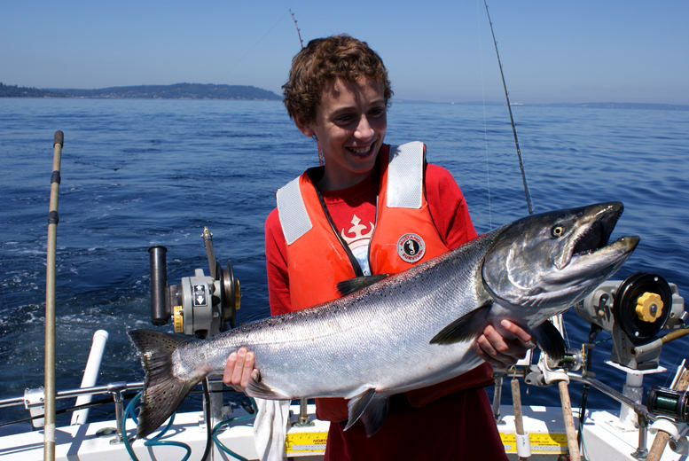 Jack Hessburg lands an ultra-rare white king salmon, just off Shilshole in Seattle's Puget Sound.